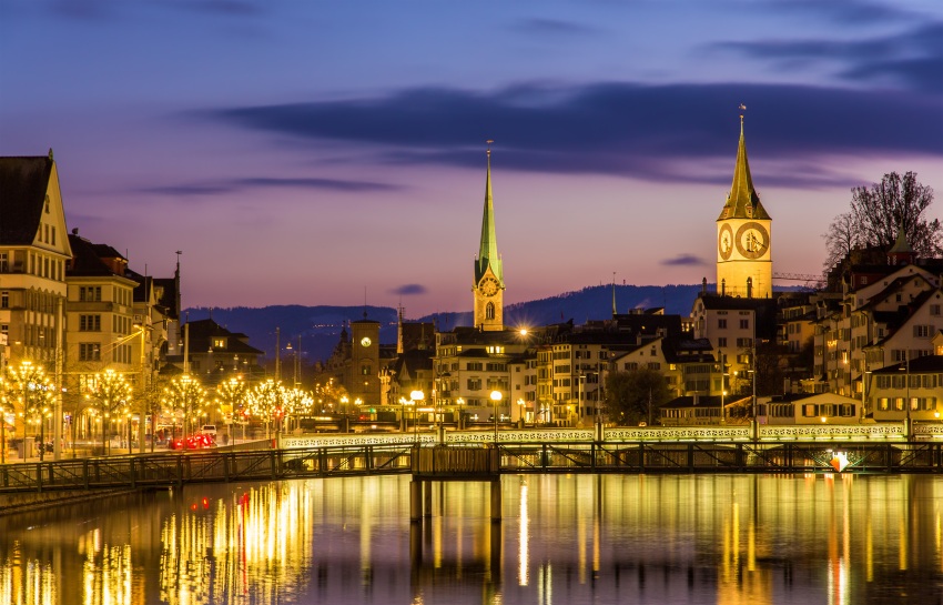Zurych Zurich on banks of Limmat river on a winter evening