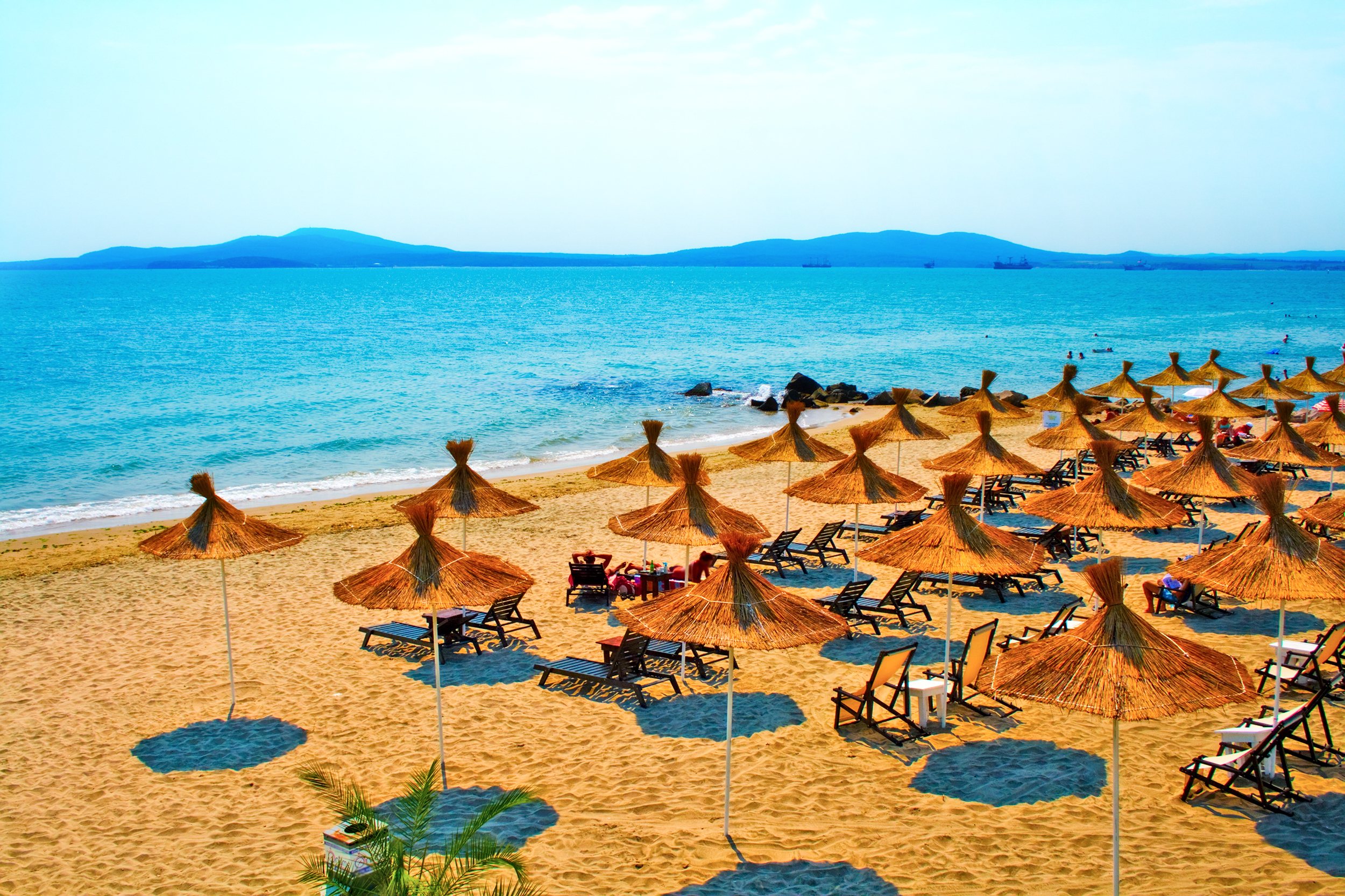 Seascape - straw umbrellas on peaceful beach in Bulgaria